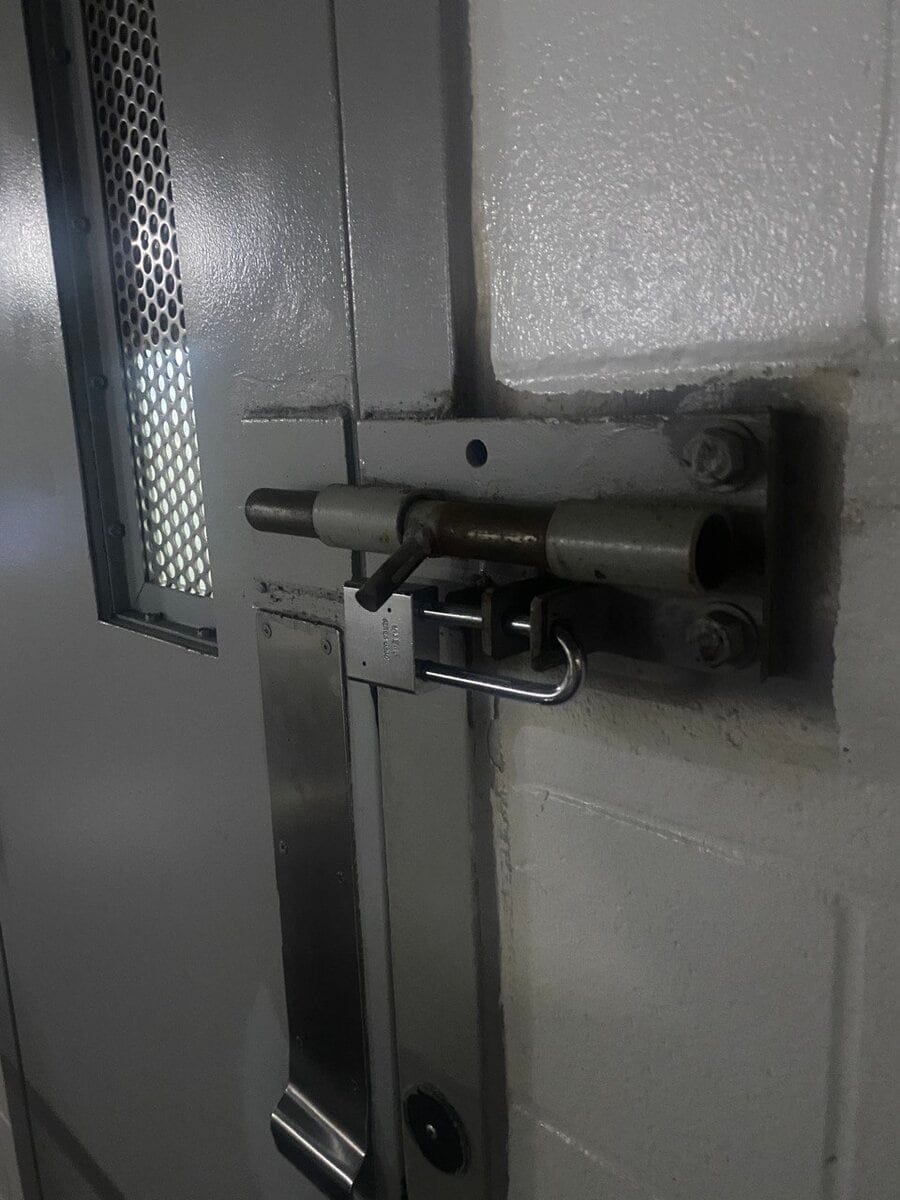 Second view of the padlocked barrel bolt, Georgia state prison, 2022